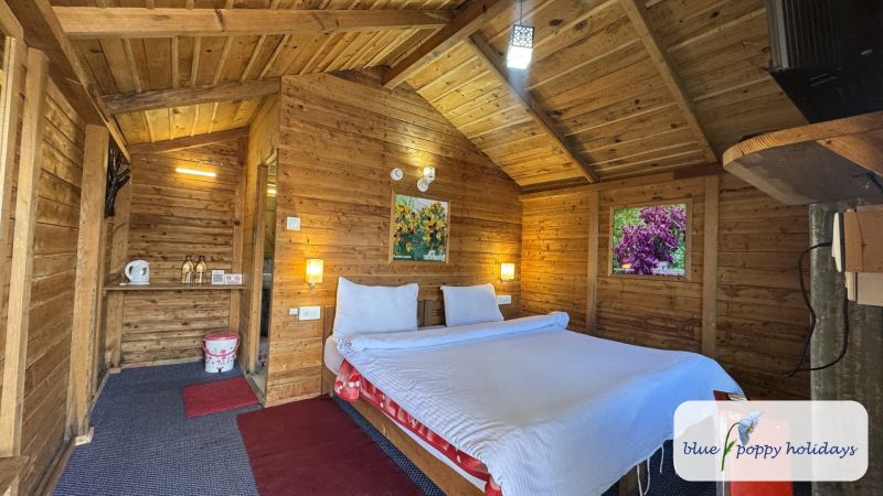 Inside a wood-lined hut at Blue Poppy Resort, Auli